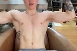 Tattooed English lad shows off his muscles on camera