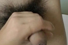 Handsome, slim Asian boy finds himself in a kinky situation. Bound and helpless, he expertly pleasures a well-hung guy with his skilled hands, culminating in a satisfying climax.