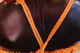 Yoshi Kawasaki, a bound and gagged Asian stud, undergoes extreme BDSM in a black suit. His tight hole is prepped with lube before a massive fist and toys are brutally forced. Yoshikawasaki's hardcore fetish video showcases intense fisting, bondage, and anal play, culminating in a kinky peeing scene.