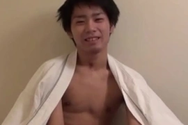 A youthful Japanese twink flaunts his smooth, average-sized cock, expertly stroking it to a creamy climax. His eager jerking and moans make for an enticing solo performance.