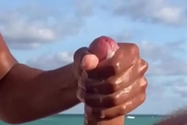 Cumshot on the nude beach
