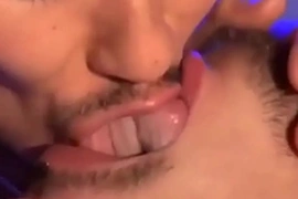 Two gay men tongue and spit kissing (lots of tongue)